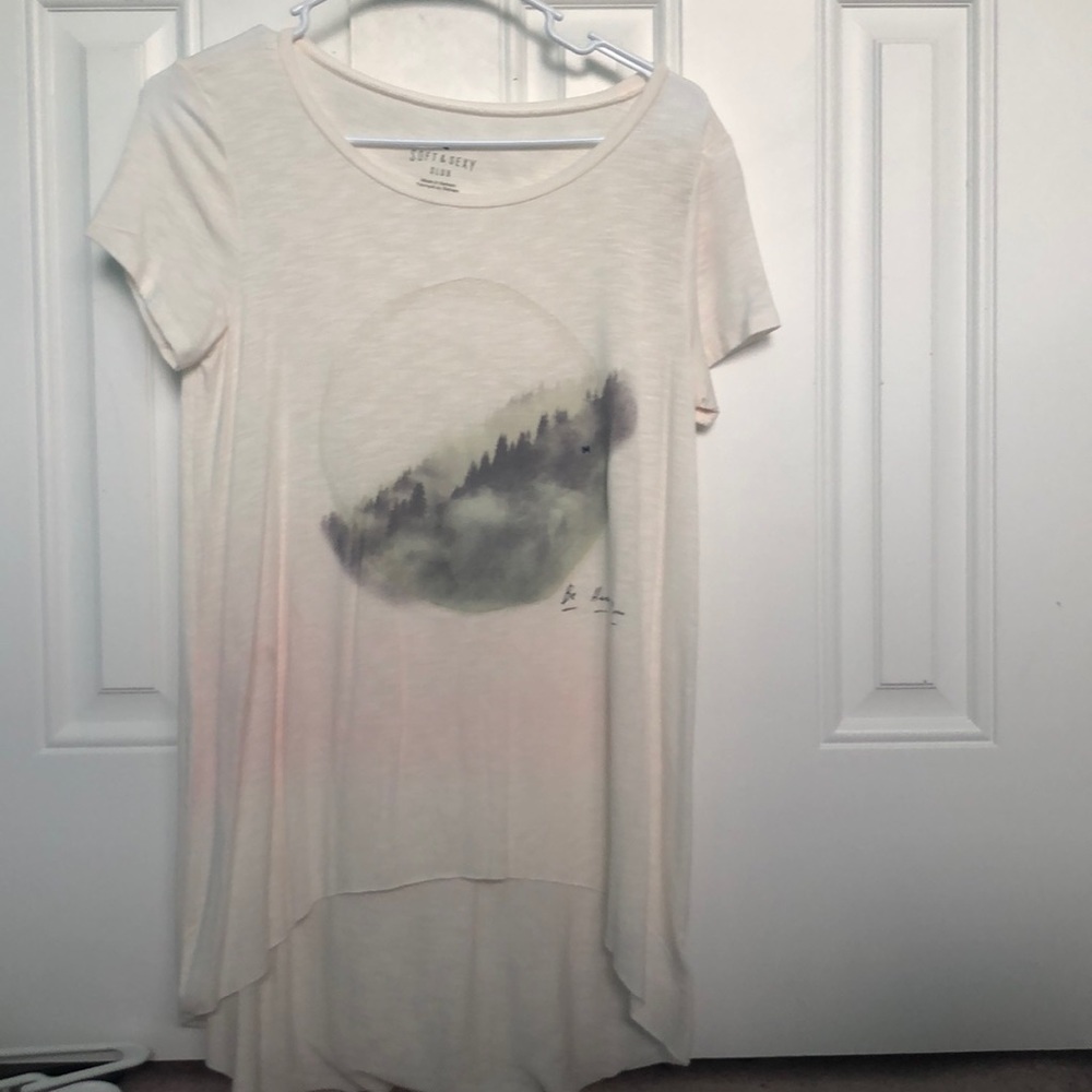 cream shirt with mountains in middle